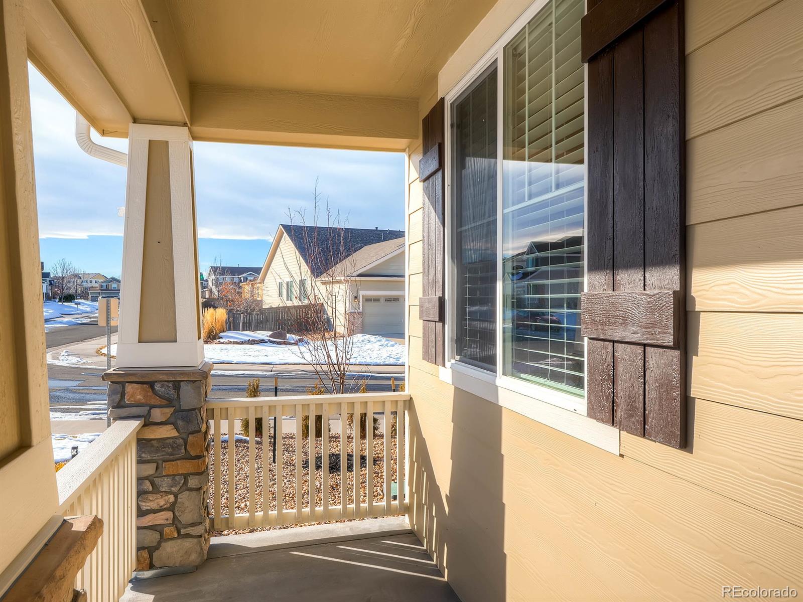 714 Springvale Road Castle Rock, CO 80104 - Photo 24 of 28 a view of a living room with a floor to ceiling window and kitchen