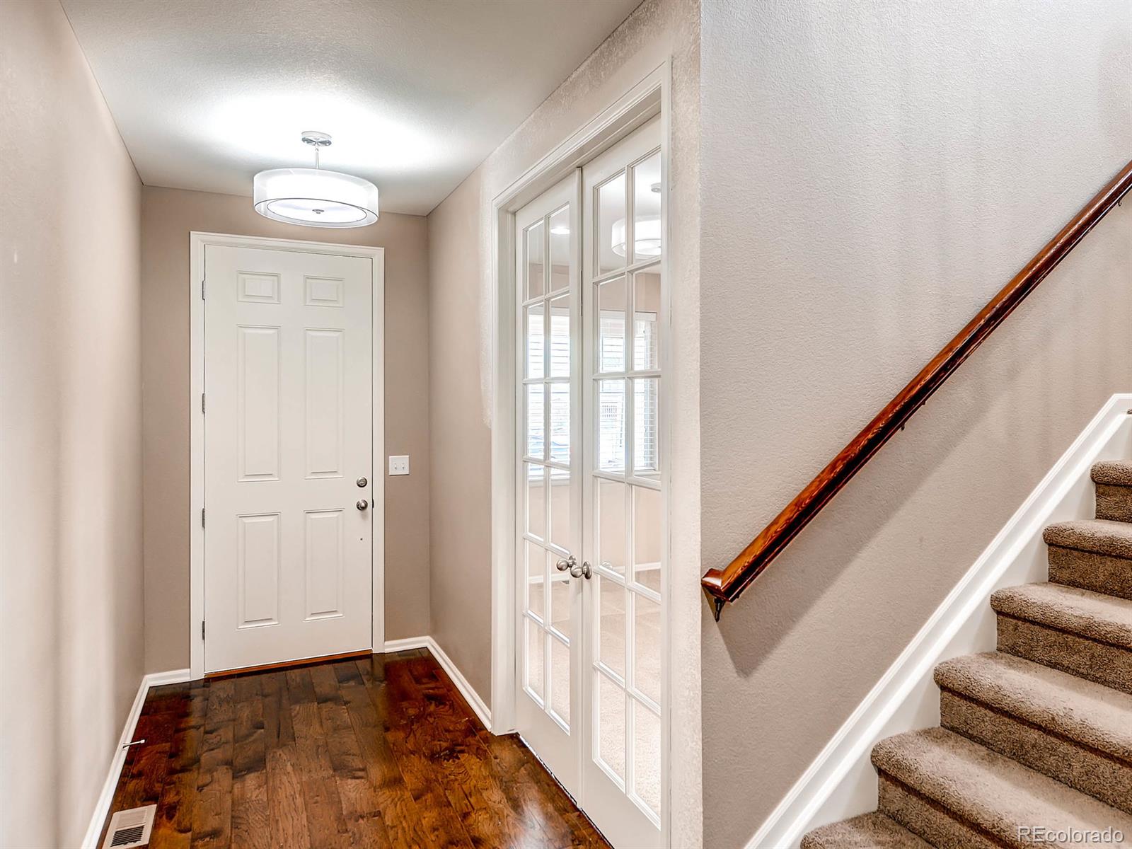 714 Springvale Road Castle Rock, CO 80104 - Photo 4 of 28 a view of an entryway with wooden floor