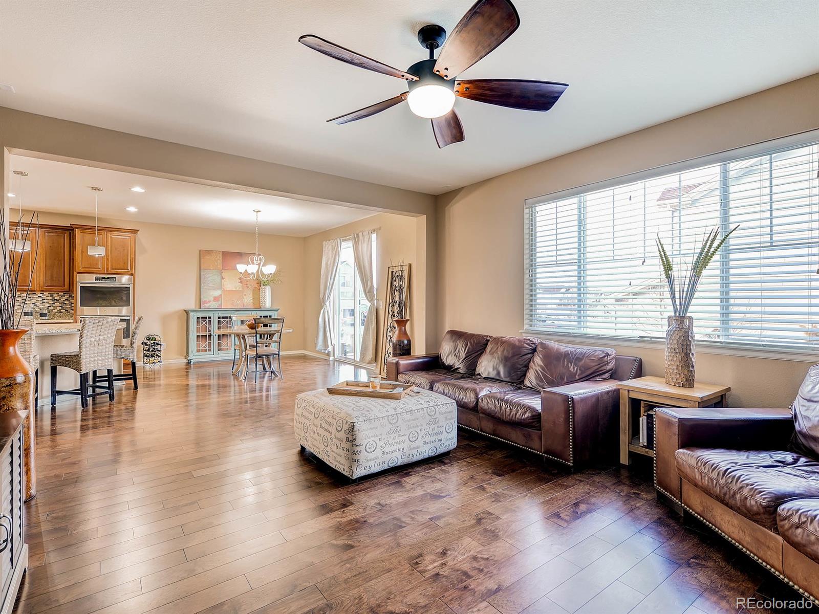 714 Springvale Road Castle Rock, CO 80104 - Photo 7 of 28 a living room with furniture and a large window