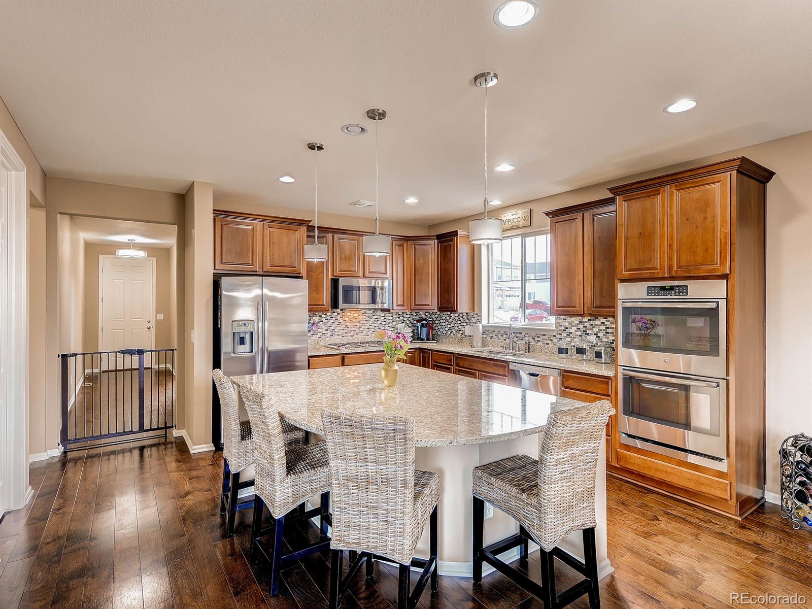 714 Springvale Road Castle Rock, CO 80104 - Photo 10 of 28 a large kitchen with a table and chairs