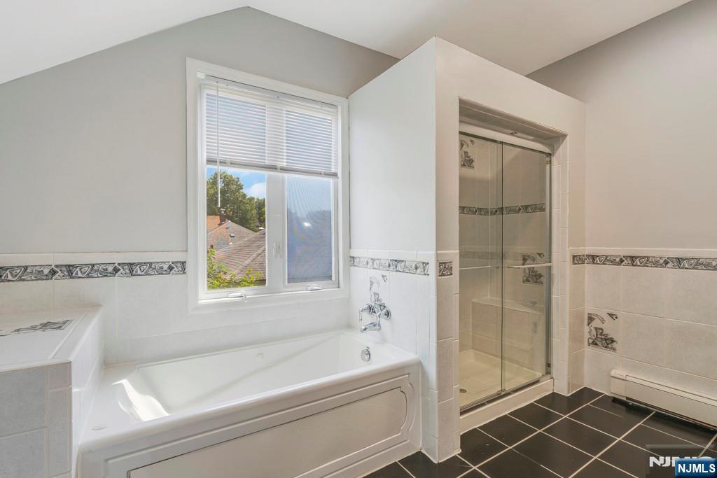 24 Sunderland Avenue Rutherford, NJ 07070 - Photo 22 of 40 a bathroom with a bathtub and a shower