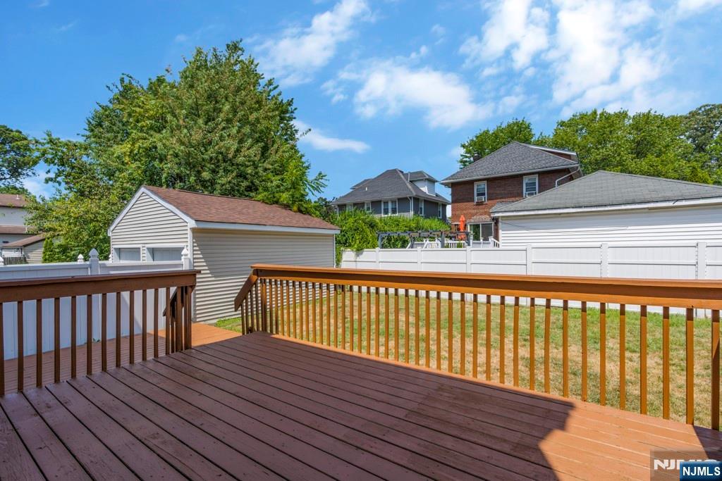 24 Sunderland Avenue Rutherford, NJ 07070 - Photo 28 of 40 a view of a wooden deck with a yard