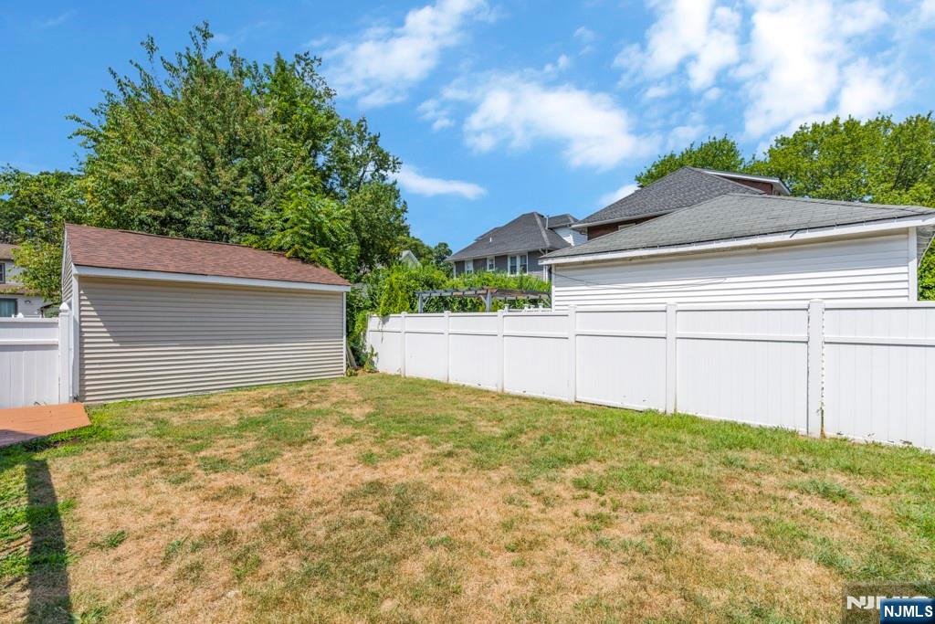 24 Sunderland Avenue Rutherford, NJ 07070 - Photo 30 of 40 a view of white house with a yard and large tree