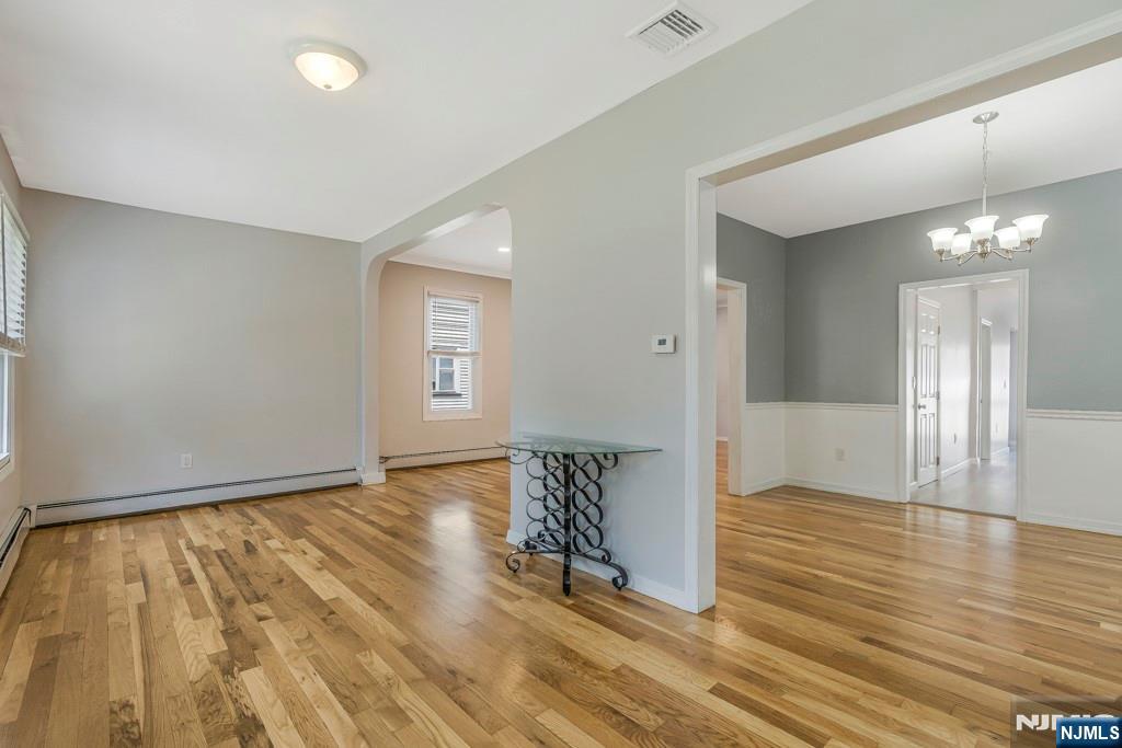 24 Sunderland Avenue Rutherford, NJ 07070 - Photo 4 of 40 wooden floor in an empty room with a window