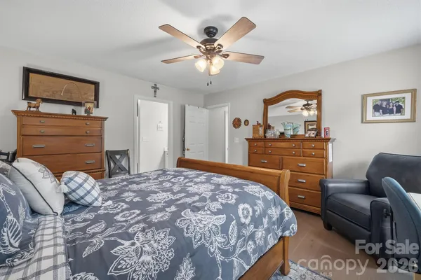 a bedroom with a bed and dresser