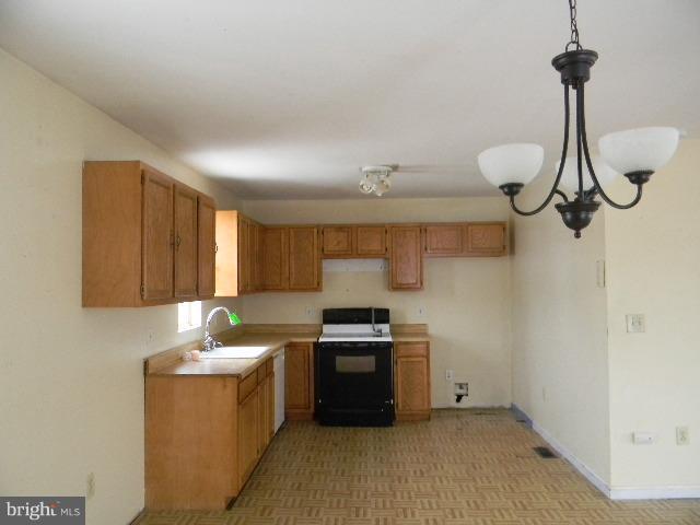 3922 North Point Road Baltimore, MD 21222 - Photo 2 of 22 a kitchen with granite countertop a sink stainless steel appliances and cabinets