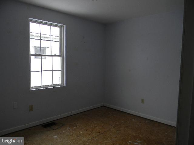 3922 North Point Road Baltimore, MD 21222 - Photo 13 of 22 an empty room with a window