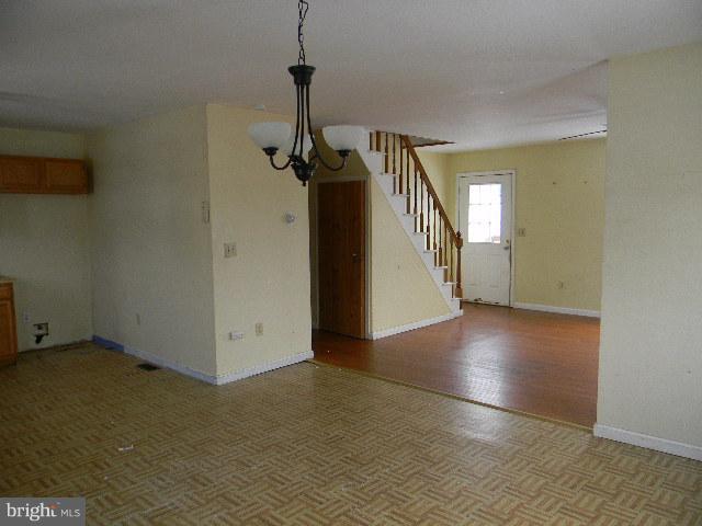 3922 North Point Road Baltimore, MD 21222 - Photo 4 of 22 a view of empty room with a ceiling fan