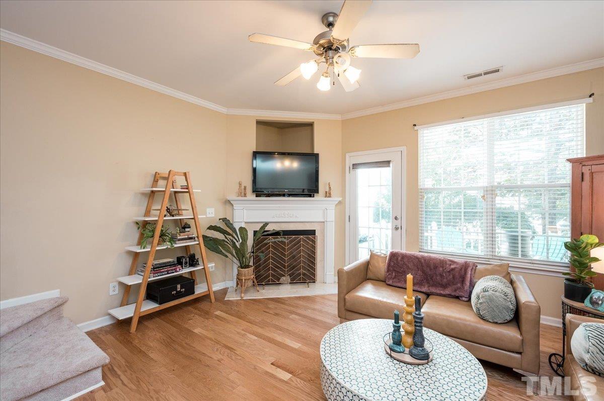 8342 City Loft Court Raleigh, NC 27613 - Photo 13 of 23 a living room with furniture fireplace and a large window