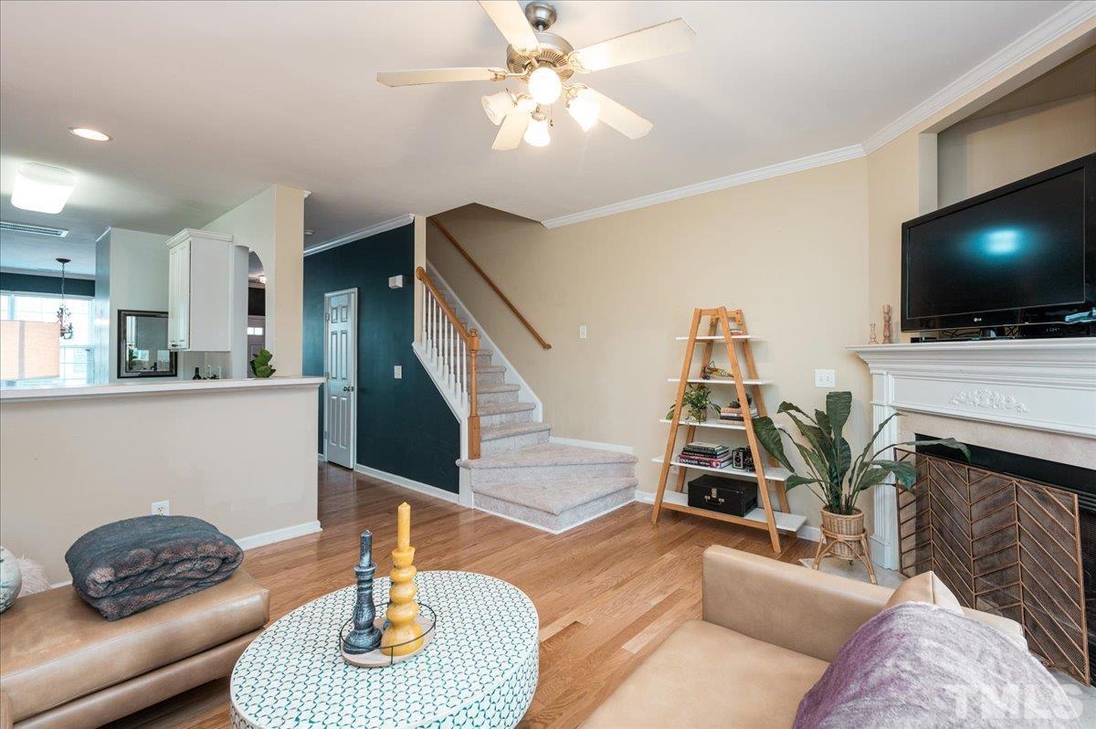8342 City Loft Court Raleigh, NC 27613 - Photo 14 of 23 a living room with furniture and a flat screen tv