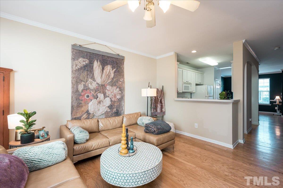 8342 City Loft Court Raleigh, NC 27613 - Photo 15 of 23 a living room with furniture and a wooden floor