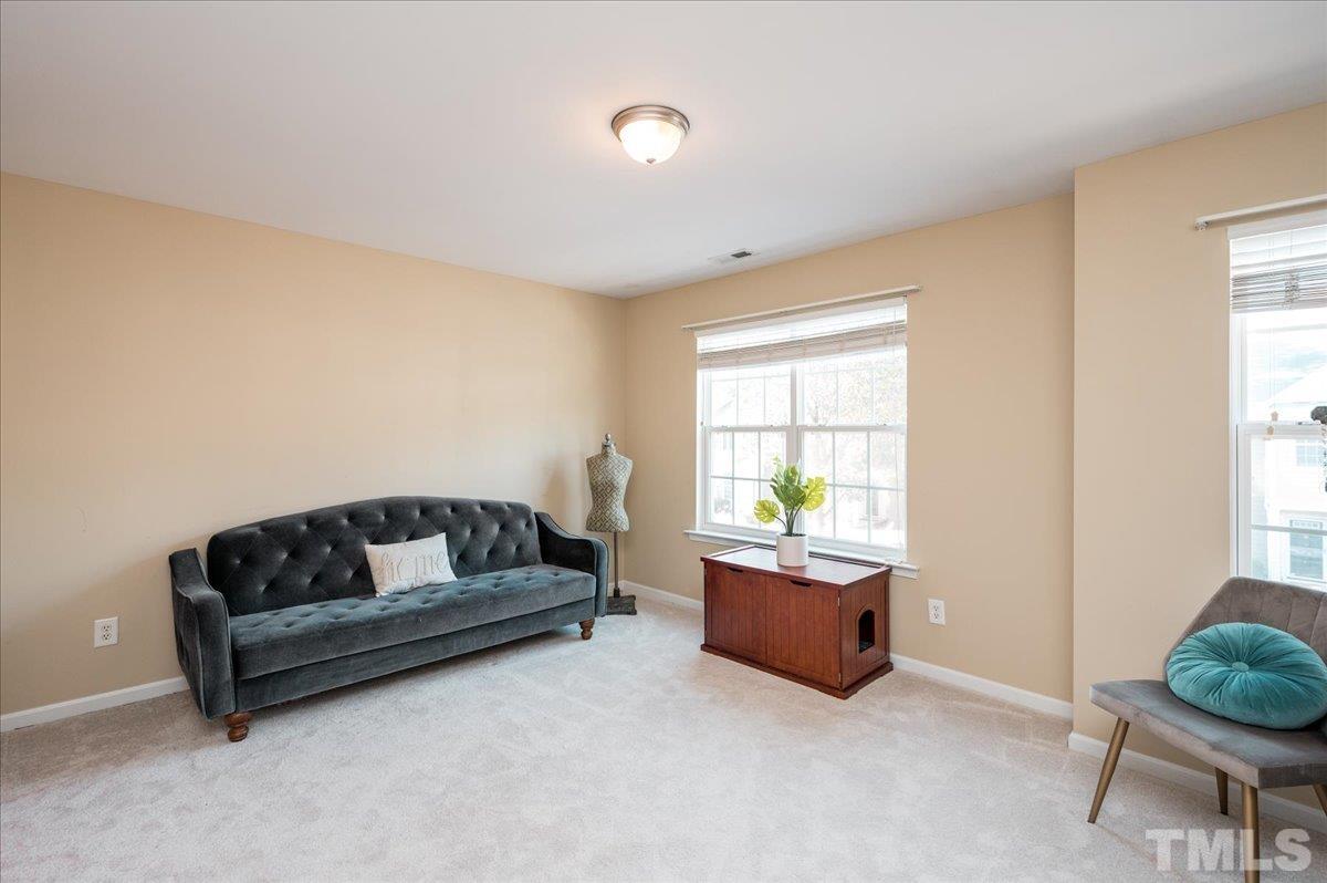 8342 City Loft Court Raleigh, NC 27613 - Photo 16 of 23 a living room with furniture and a window