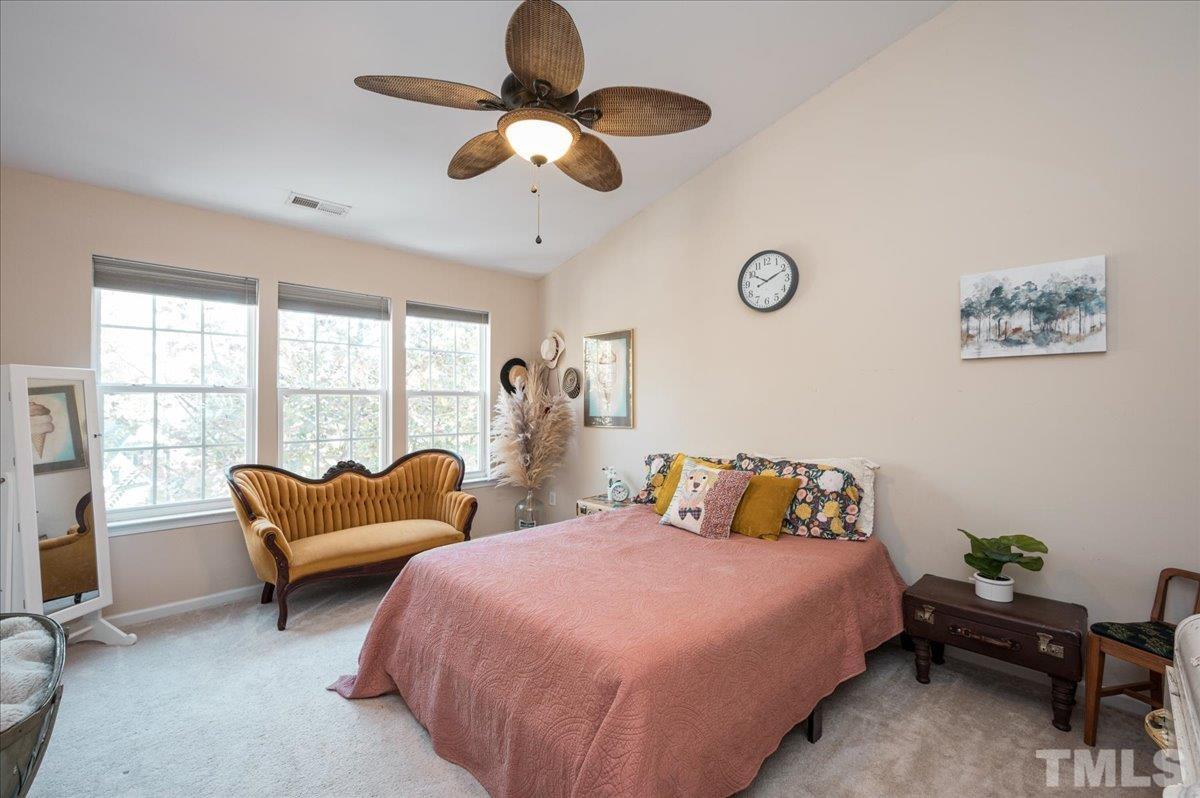 8342 City Loft Court Raleigh, NC 27613 - Photo 19 of 23 a bedroom with 2 bed and a large window