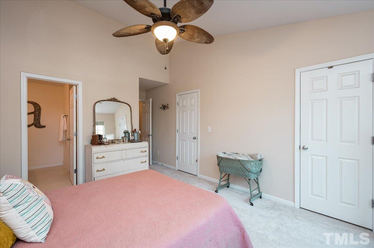 8342 City Loft Court Raleigh, NC 27613 - Photo 20 of 23 a bedroom with a bed and a dresser