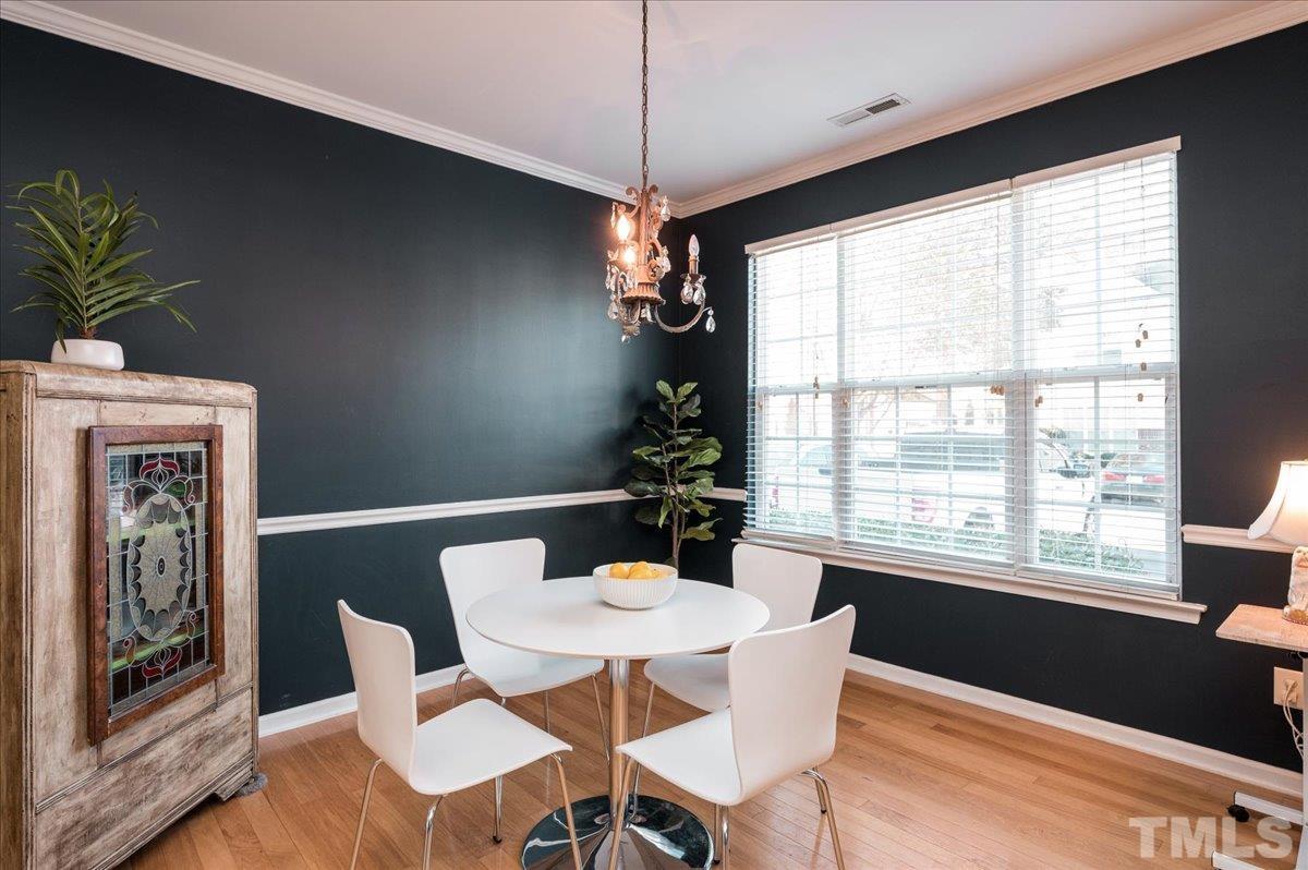 8342 City Loft Court Raleigh, NC 27613 - Photo 5 of 23 a dining room with furniture and window