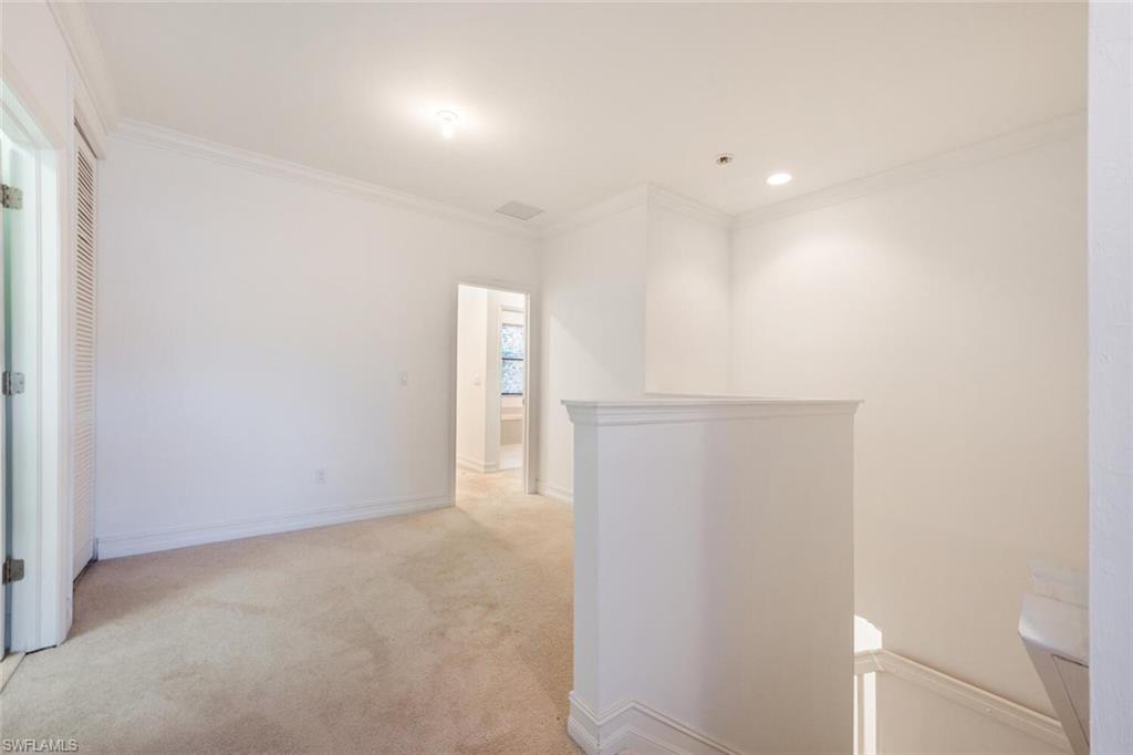 7761 Bristol Circle Naples, FL 34120 - Photo 12 of 32 a view of an empty room