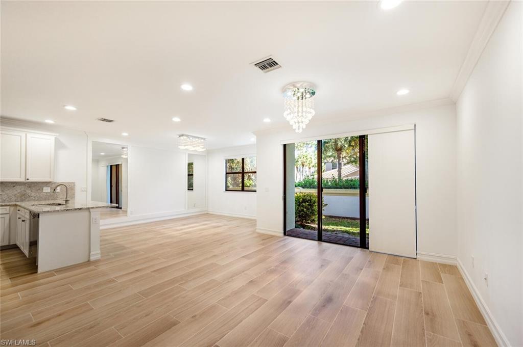 7761 Bristol Circle Naples, FL 34120 - Photo 3 of 32 a view of a kitchen with a sink and a refrigerator
