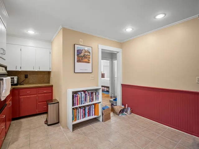 a room with furniture and book shelf