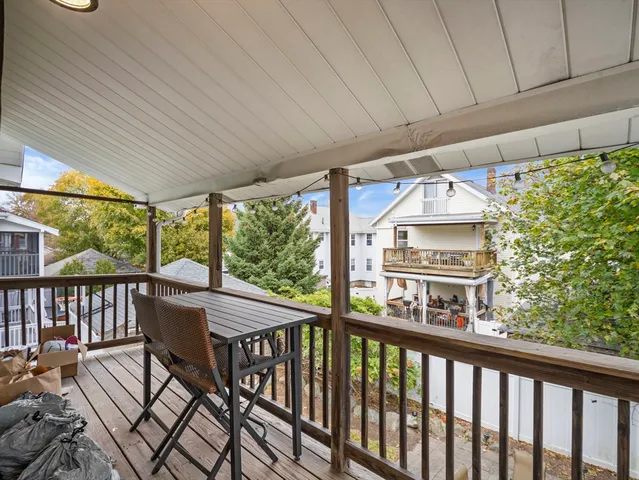 a view of a two chairs in the balcony