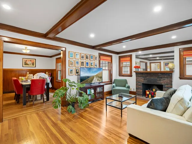 a living room with fireplace furniture and a fireplace