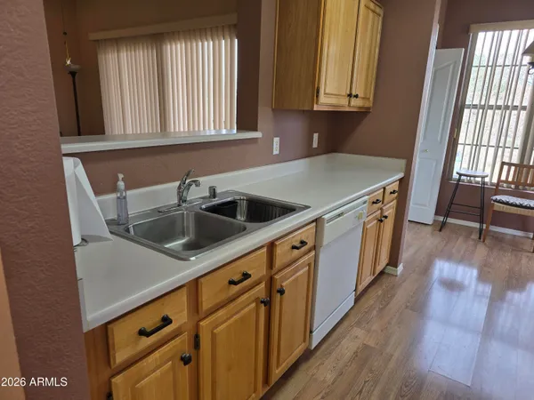 a kitchen with stainless steel appliances a refrigerator and a stove
