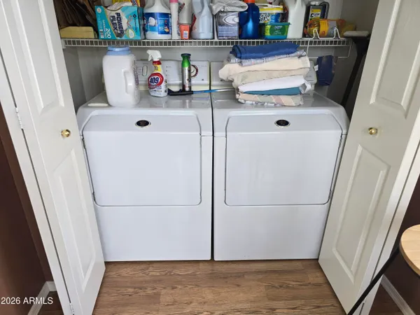 a kitchen with stainless steel appliances granite countertop a refrigerator and a stove