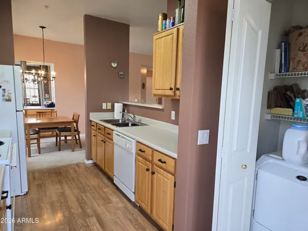 a kitchen with a sink a stove and cabinets