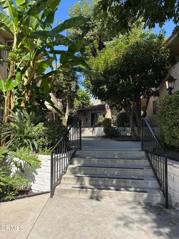 a view of house with a yard