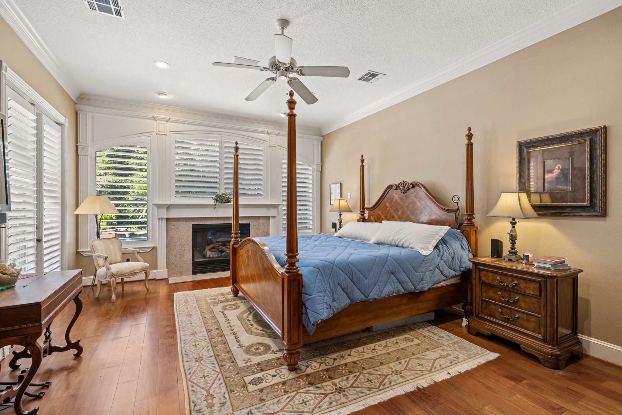 3018 McDonald Lane Spring, TX 77380 - Photo 13 of 48 a bedroom with a bed and a fireplace