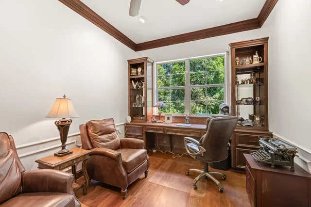 a work room with furniture and a window
