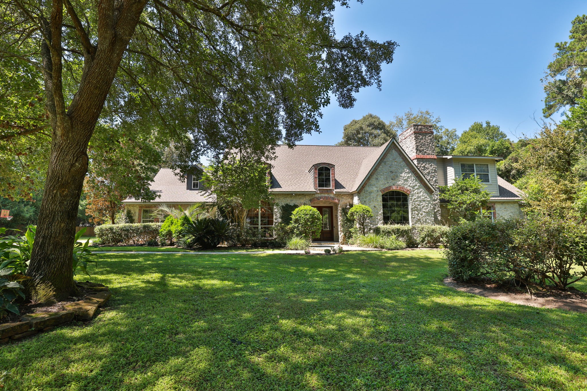 3018 McDonald Lane Spring, TX 77380 - Photo 2 of 48 a front view of a house with a yard