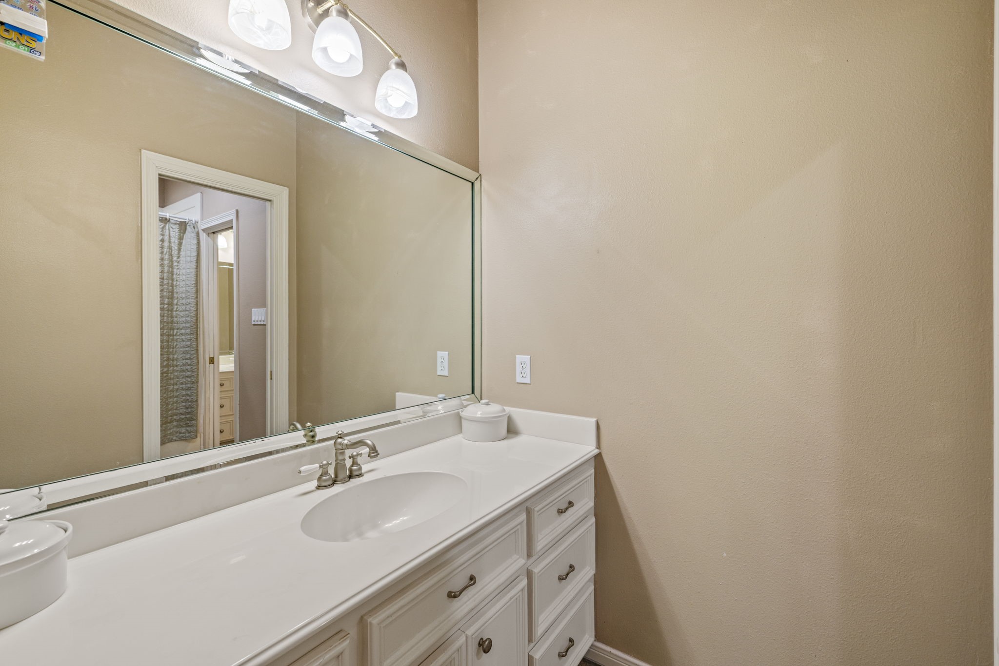 3018 McDonald Lane Spring, TX 77380 - Photo 21 of 48 a bathroom with a sink and a mirror