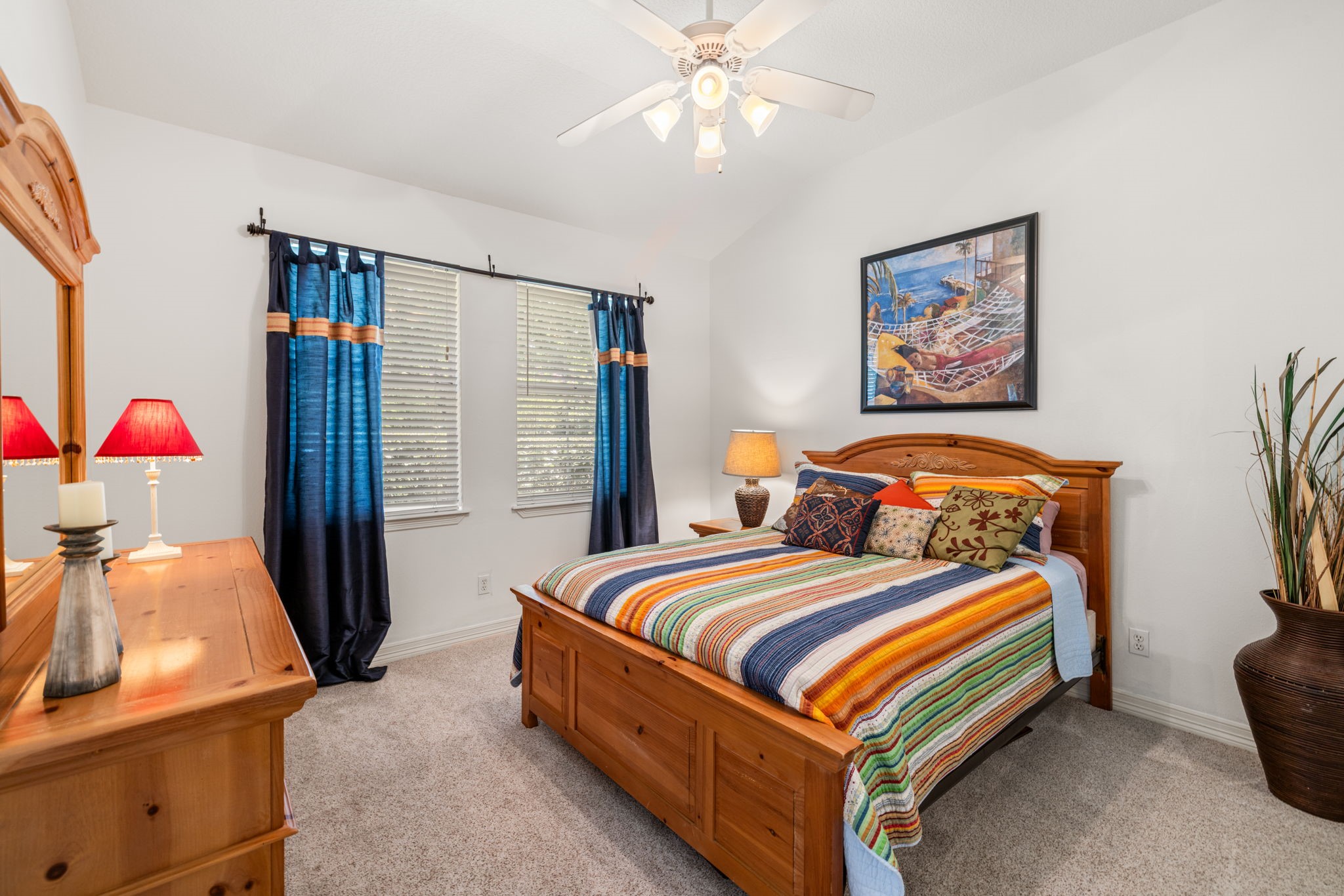 3018 McDonald Lane Spring, TX 77380 - Photo 23 of 48 a bedroom with a bed and a chandelier