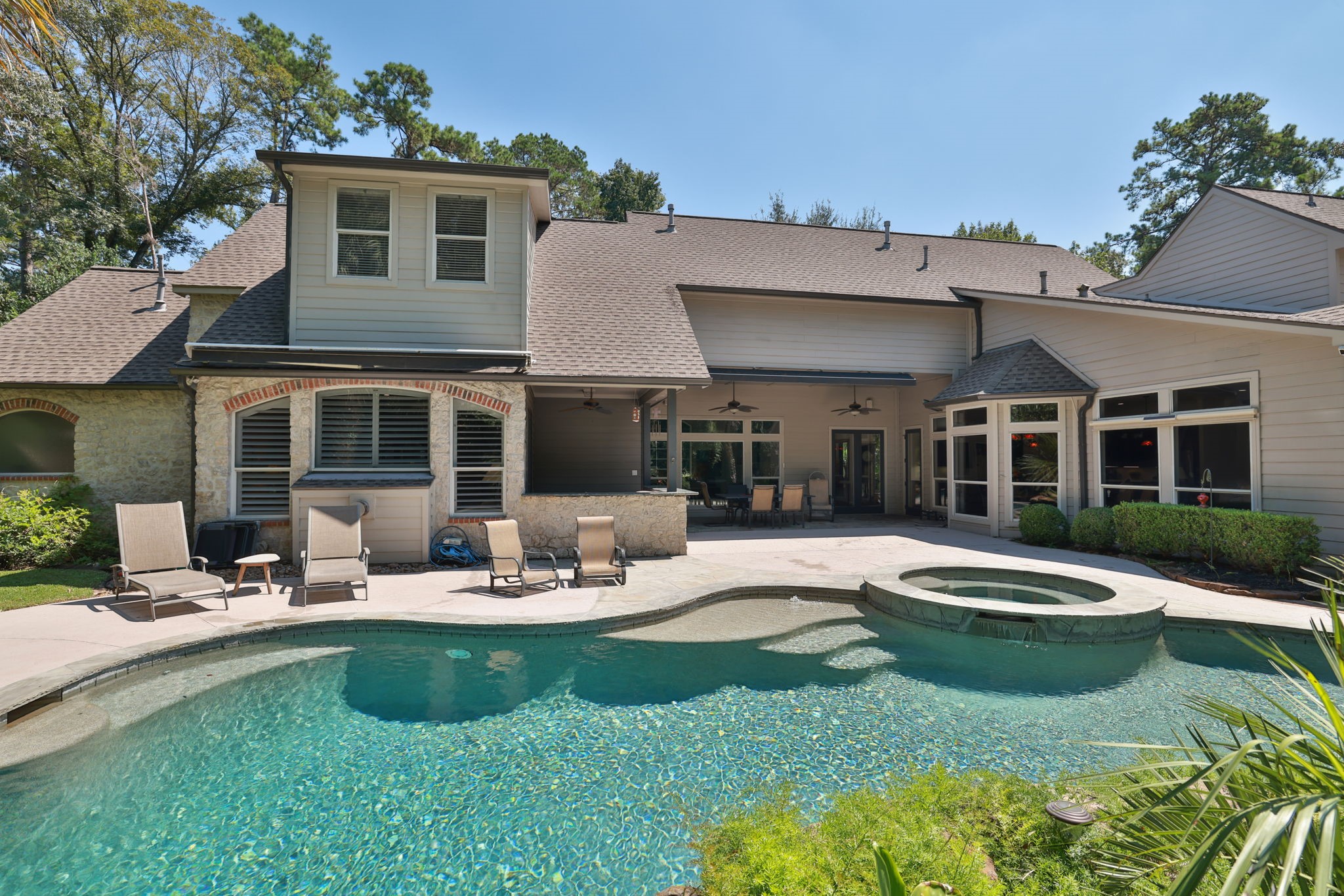 3018 McDonald Lane Spring, TX 77380 - Photo 27 of 48 a patio with a table and chairs and plants
