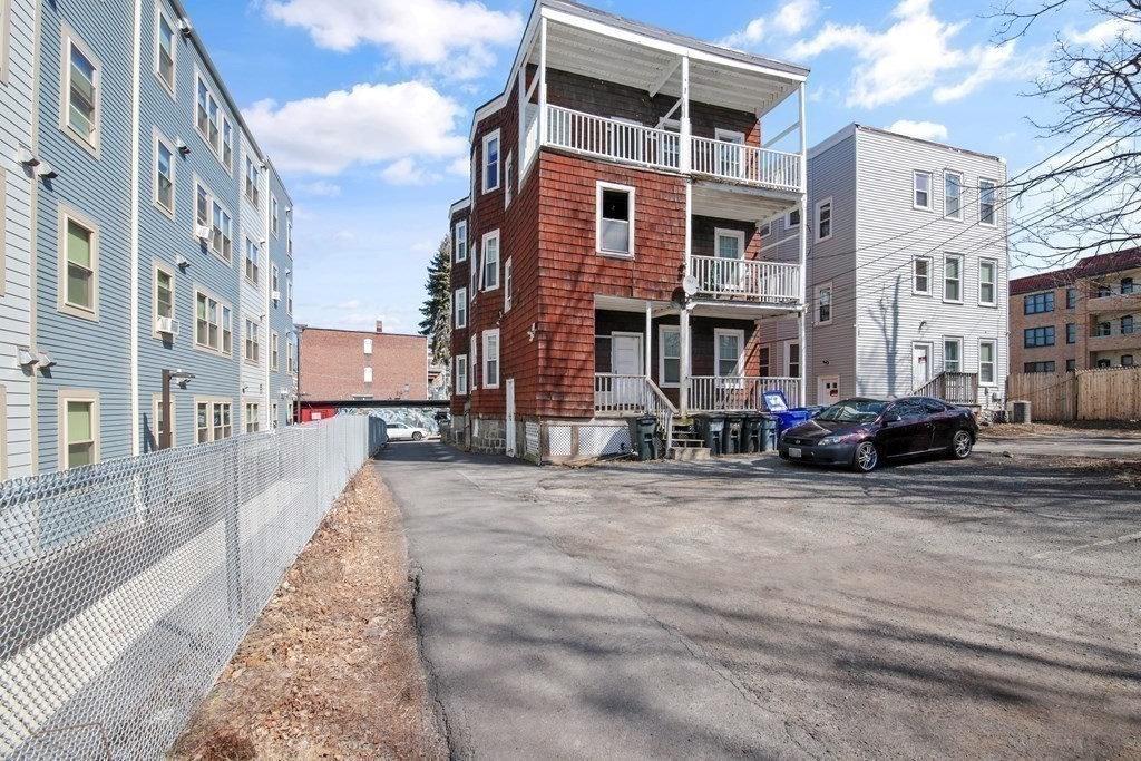 71 Walnut Park Boston, MA 02119 - Photo 17 of 36 a view of a street with buildings