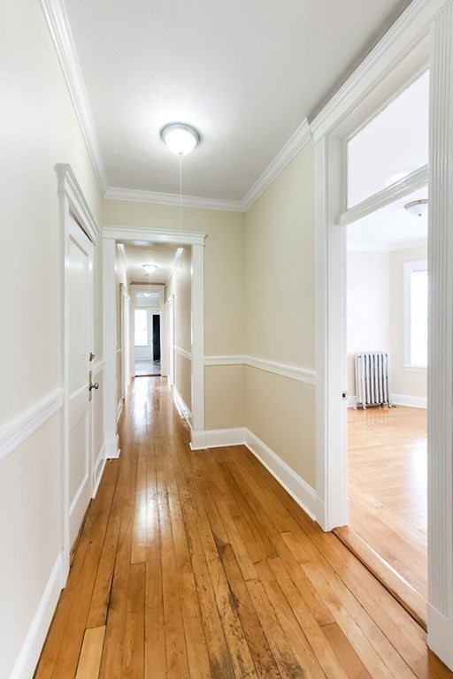 71 Walnut Park Boston, MA 02119 - Photo 21 of 36 a view of a hallway with wooden floor