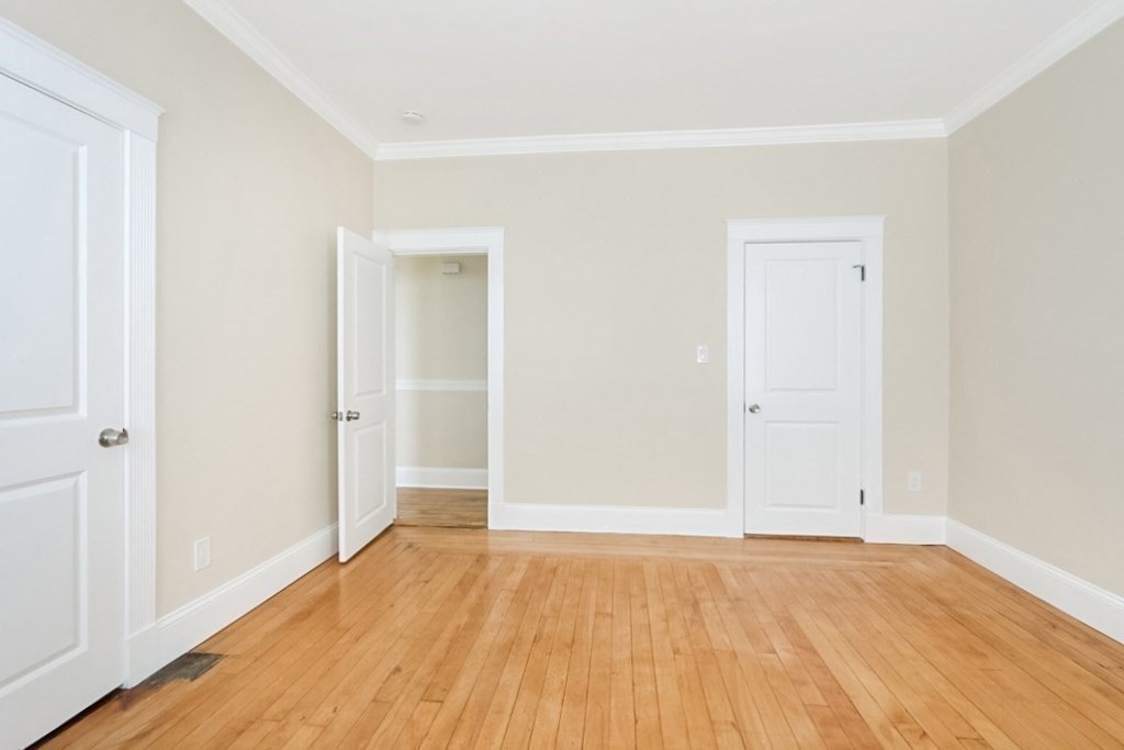 71 Walnut Park Boston, MA 02119 - Photo 22 of 36 wooden floor in an empty room