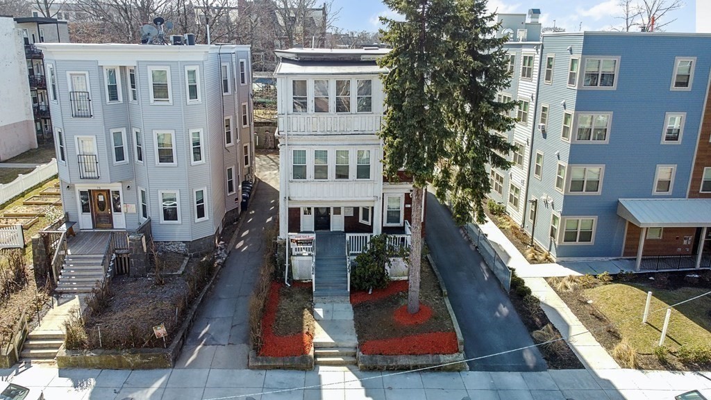 71 Walnut Park Boston, MA 02119 - Photo 27 of 36 a view of a building with many windows