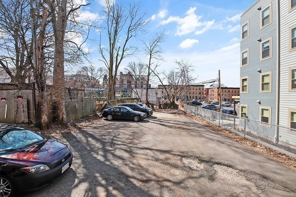 71 Walnut Park Boston, MA 02119 - Photo 28 of 36 a view of a street with cars