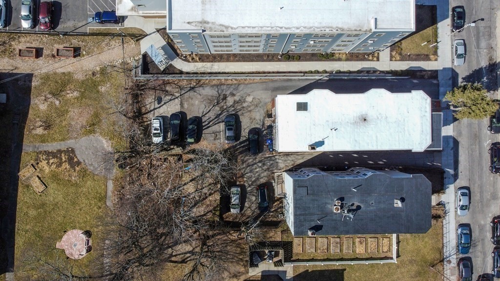 71 Walnut Park Boston, MA 02119 - Photo 32 of 36 a aerial view of a house with a garden