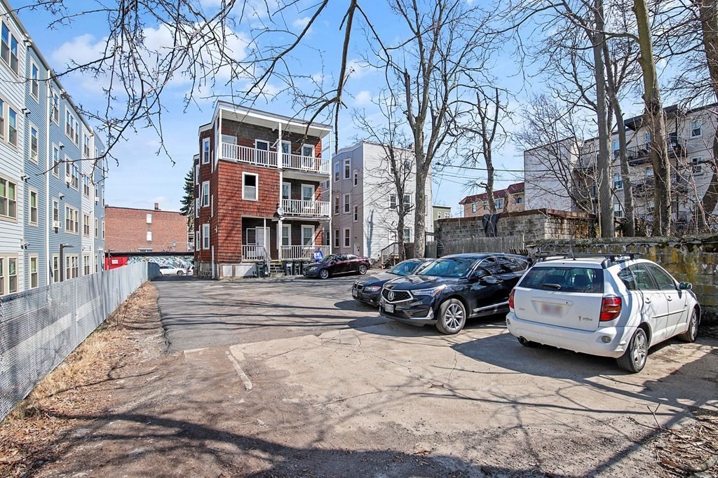 71 Walnut Park Boston, MA 02119 - Photo 5 of 36 a view of a cars parked in front of a building