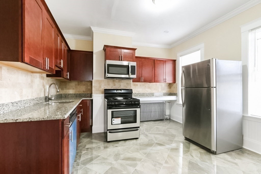 71 Walnut Park Boston, MA 02119 - Photo 7 of 36 a kitchen with a refrigerator sink and microwave