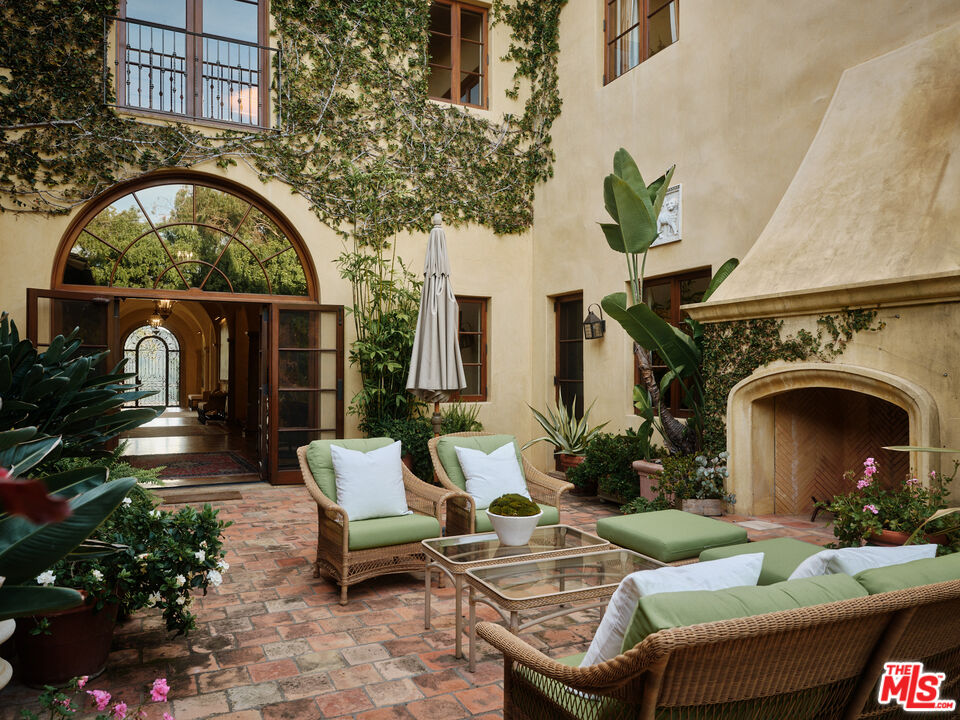 10939 Chalon Road Los Angeles, CA 90077 - Photo 20 of 24 a front view of a house with garden