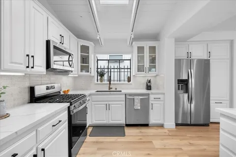 a bed room with a bed and a large window