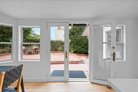 a view of a bedroom with furniture and window