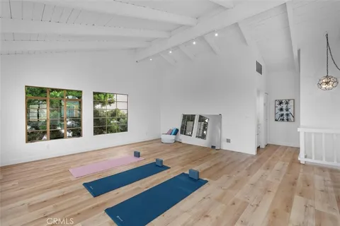a bathroom with a granite countertop sink a toilet and a shower