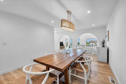 a kitchen with stainless steel appliances granite countertop a refrigerator sink and cabinets