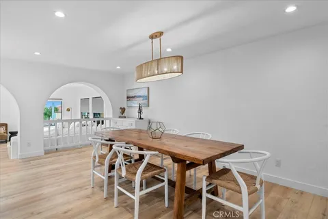 a large kitchen with stainless steel appliances granite countertop a large center island and a wooden cabinets