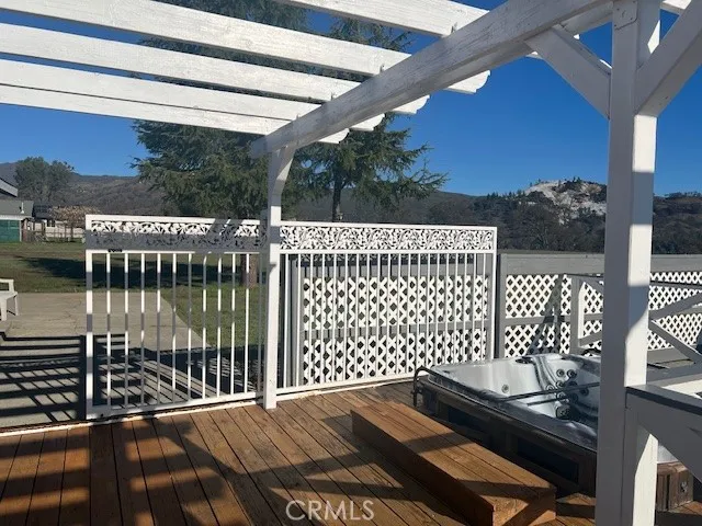 a view of an empty room with closet and a window