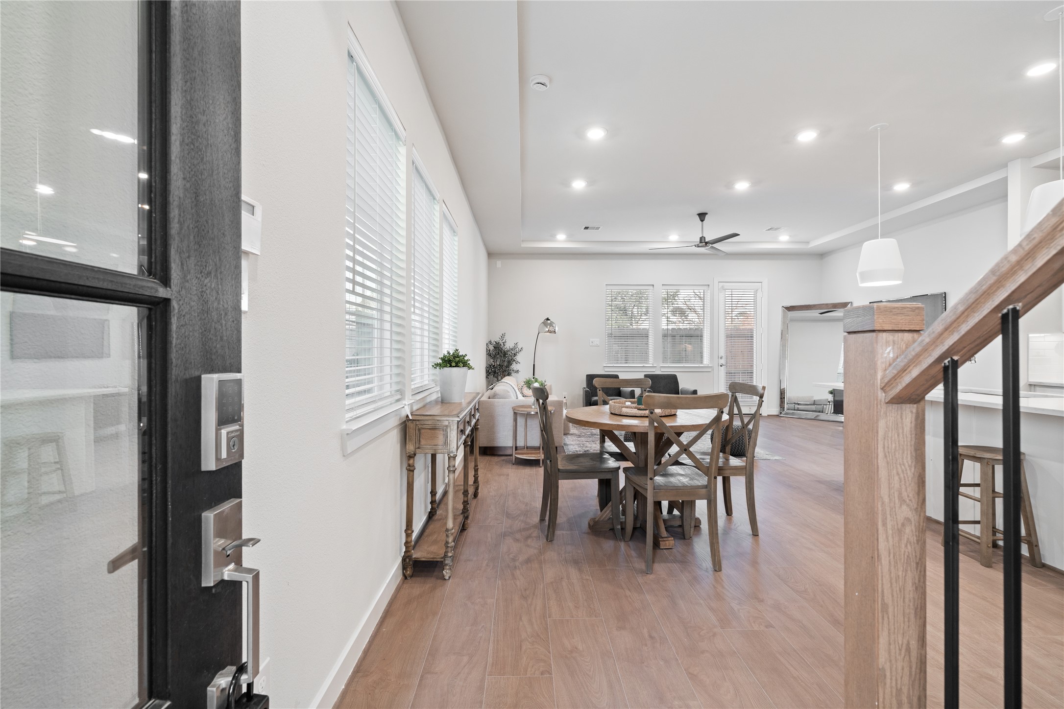 6451 Rena Street Houston, TX 77092 - Photo 4 of 33 The door opens to warm flooring and natural light that immediately softens the modern lines.